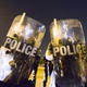 Protesters face off with police in riot gear across the street from the Baton Rouge, La., Police Department on July 8, 2016, in the wake of the fatal police shooting of Alton Sterling.
Mark Wallheiser/Getty Images